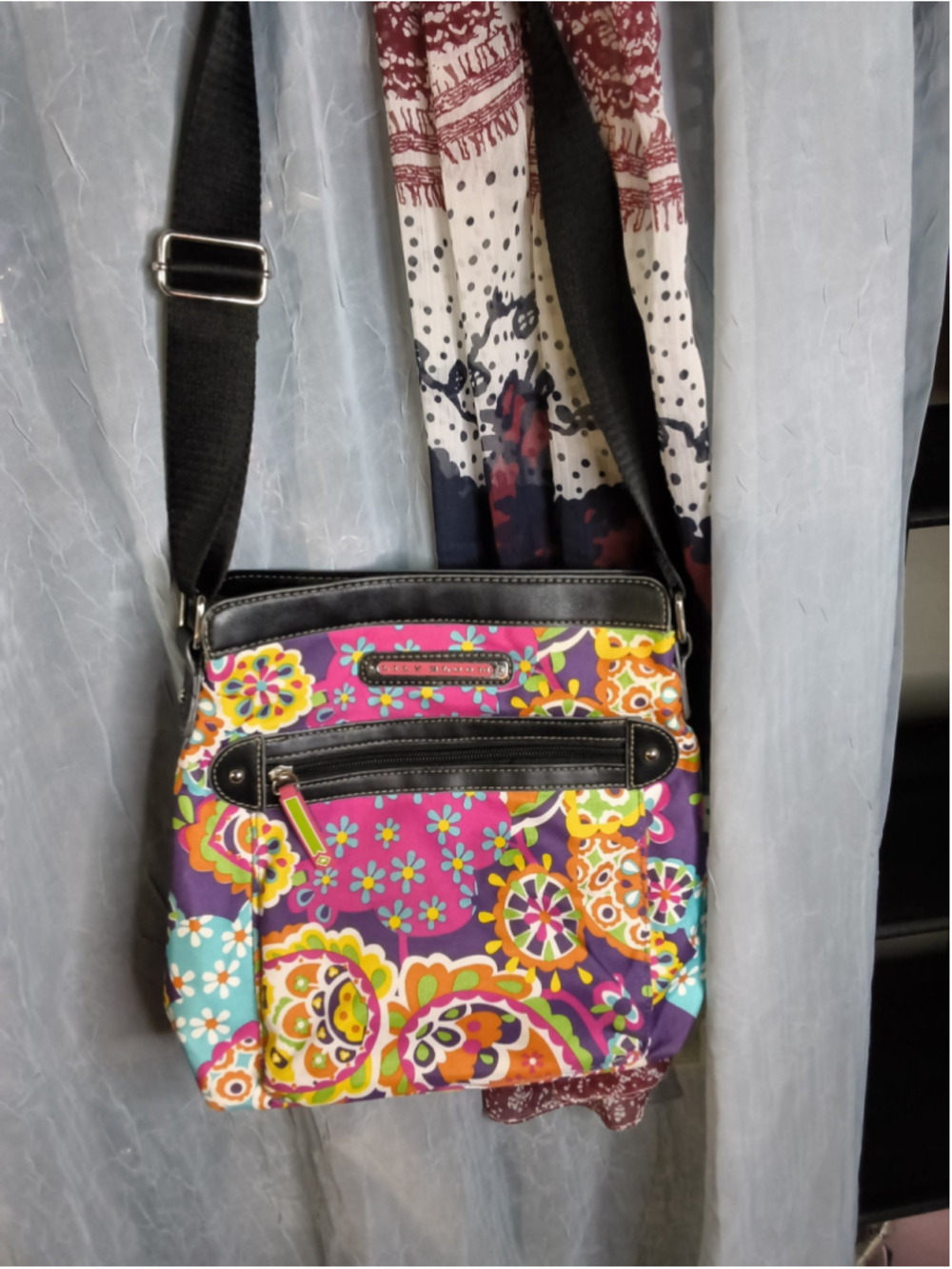 Lily Bloom Crossbody Bag featuring a vibrant, multicolored paisley and floral